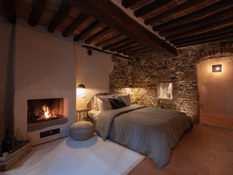 Borgo di Sotto Toscana Montefollonico Italy Accommodation Cozy Medieval Bedroom Fireplace Suite